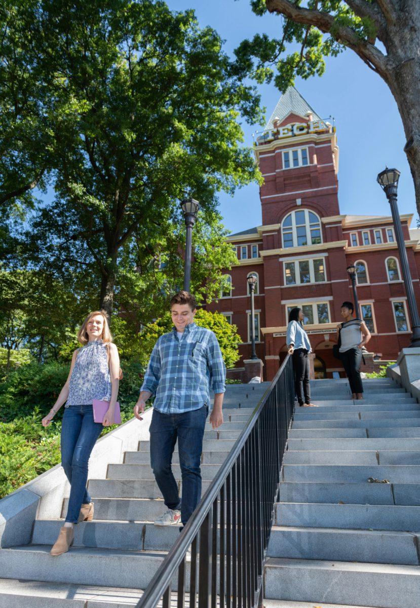 Two students walking near Tech Tower, photo