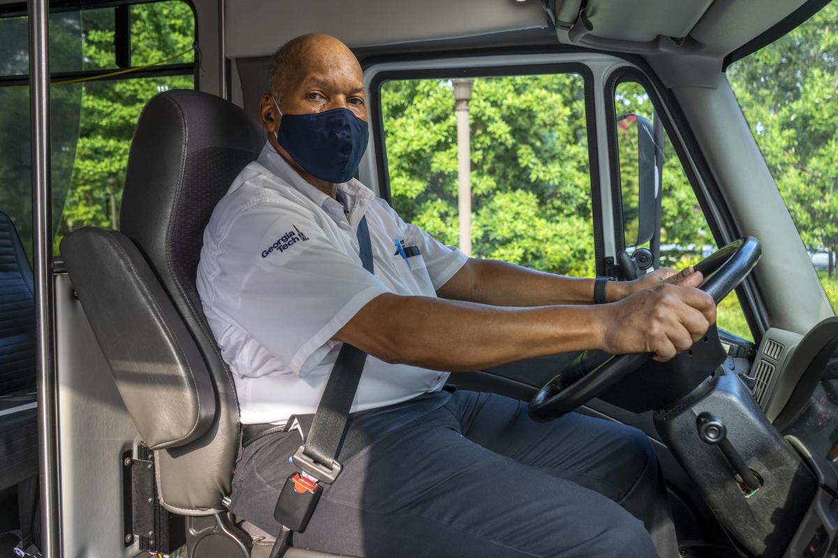 A staff member driving a Georgia Tech vehicle